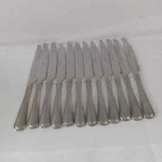 Mikasa Set Of 12 Tables Knives New. Price: $28.00.