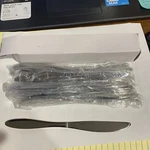 Box Of 12 New Italian Design Co. Alessi For Delta Airlines Butter Knives. Price: $17.95.