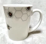 New Gibson Home Honey Bee 8OZ White Ceramic Coffee Cups. Price: $14.99.