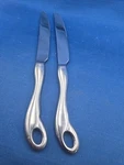 Set Of 2 Ricciolo Stainless Dinner Knives 9 5/8" Used. Price: $32.00.