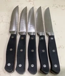 Set Of 5 Steak Knives Stainless Steel With Black Riveted Wood Look Grips, Hefty Used. Price: $22.00.