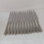 Mikasa Set Of 12 Tables Knives Used. Price: $28.00.