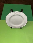 Lillian Vernon White Embossed Scroll Salad Plate Used. Price: $15.00.