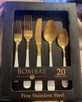Bombay Fine Stainless Steel 20 Piece Utensil Set Mirabella, Gold Top, White Hand New. Price: $65.00.